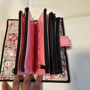 Pink and white oil cloth envelope system wallet.